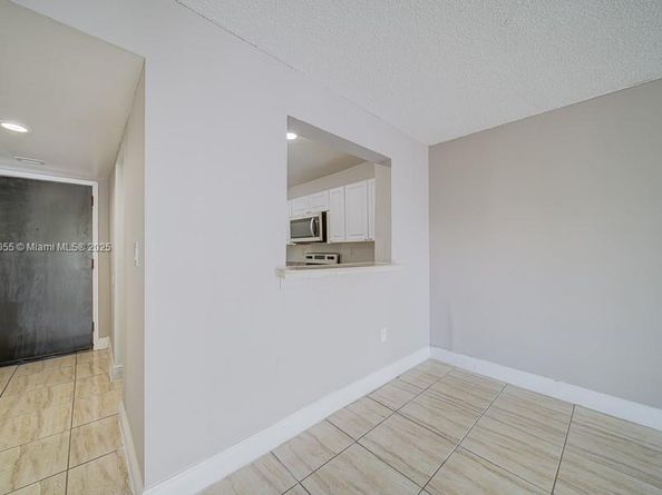 498 NW 165th St Rd D206, Miami FL 33169