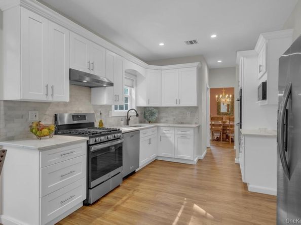 22 Whispering Woods Drive, Smithtown NY 11787