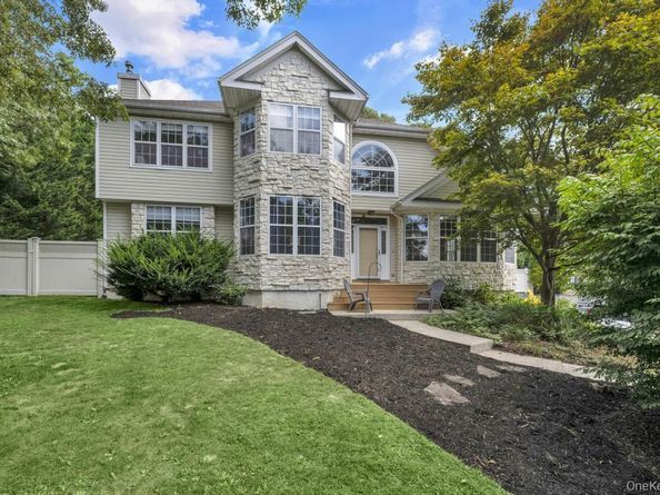 22 Whispering Woods Drive, Smithtown NY 11787