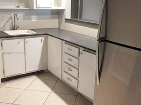 455 Golden Isles Dr 203, Hallandale Beach FL 33009