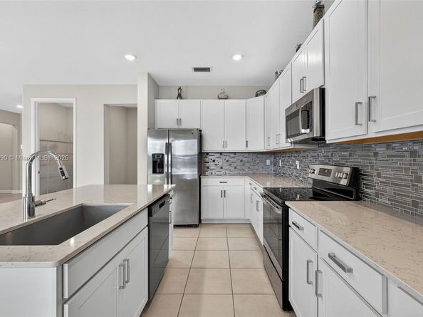 1310 Whitcombe Dr, Royal Palm Beach FL 33411