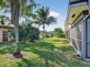 6310 Tall Cypress Cir, Green Acres FL 33463