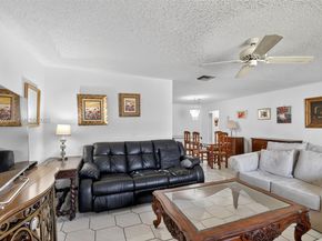 6310 Tall Cypress Cir, Green Acres FL 33463