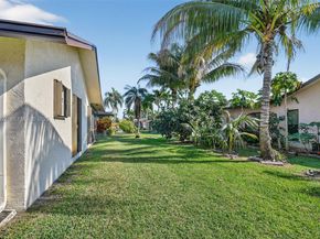 6310 Tall Cypress Cir, Green Acres FL 33463