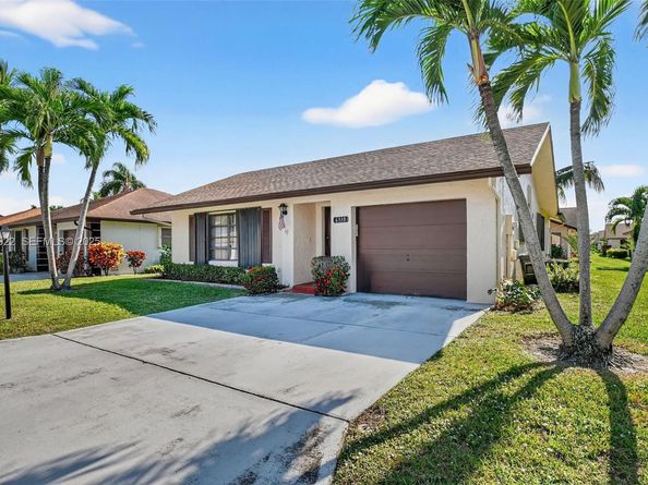 6310 Tall Cypress Cir, Green Acres FL 33463