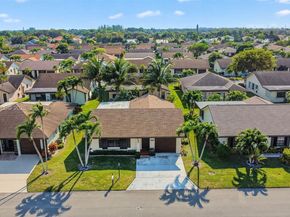 6310 Tall Cypress Cir, Green Acres FL 33463