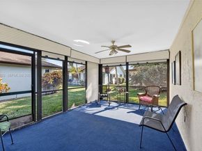 6310 Tall Cypress Cir, Green Acres FL 33463