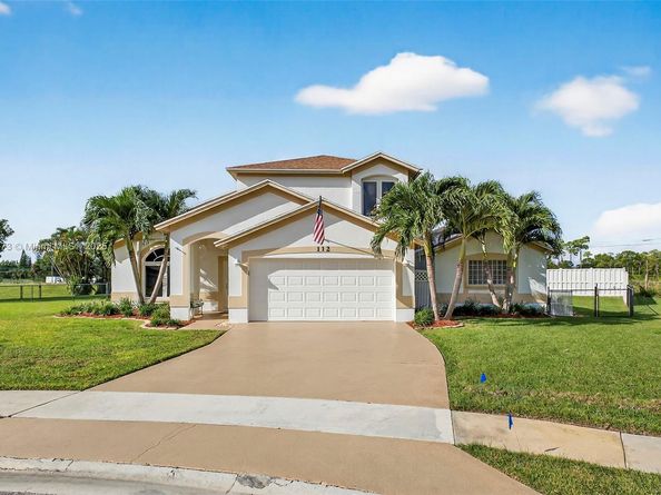 112 Camelot Ct, Royal Palm Beach FL 33411