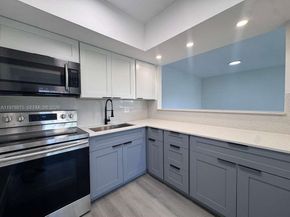 455 Golden Isles Dr 203, Hallandale Beach FL 33009