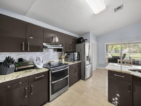 126 Hammocks Court, Greenacres FL 33413