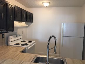 496 NW 165th St Rd D312, Miami FL 33169