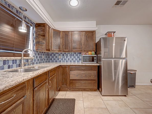 4 Carlota Court, Houston TX 77074