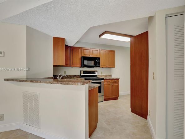 8891 Wiles Rd 102, Coral Springs FL 33067